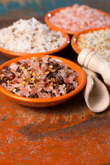 Variety of sea salt, pink Himalayan salt, colorful salt with dried chili pepper, herbs and spices.