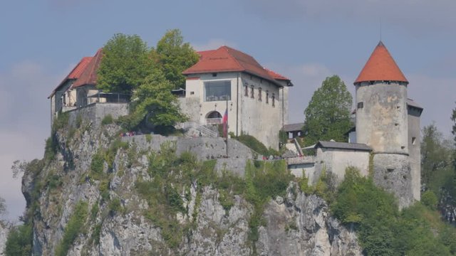 Medieval Castel Bled Lake Slovenia 4K Ulhta High Definition Timelapse. Bled lake its castle and island with church is a Slovenia iconic touristic place with terme and hotel in the Alps