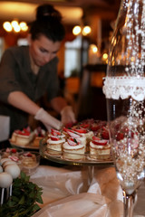 festive table with sweets and a variety of sweet snacks against 