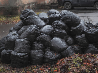 Black bags dumped in a heap.