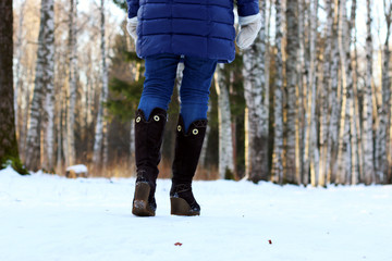 woman walk park winter snow back 