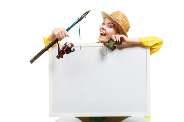 Happy woman with fishing rod holding board