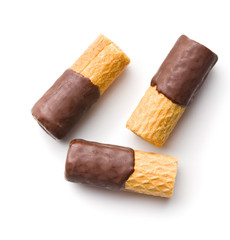 Sweet dessert. Biscuits rolls with chocolate icing.