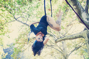 woman aerial hoop  dance in forest