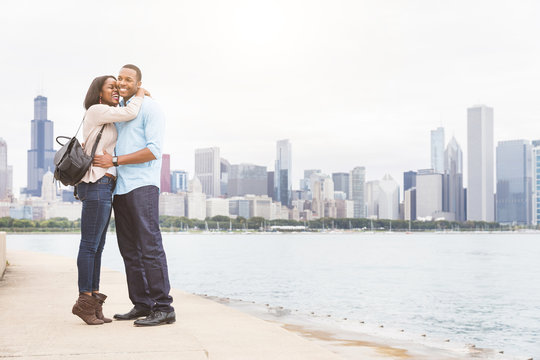 Happy black couple embracing in Chicago