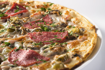 Tasty pizza with sausage and mushrooms