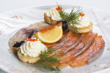 Appetizer of smoked salmon and herring