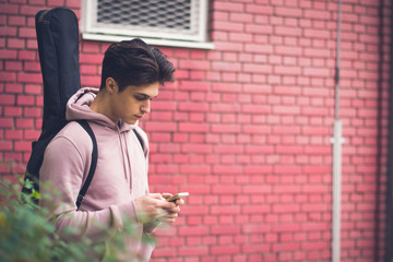 Fototapeta na wymiar Young Male Student Texting
