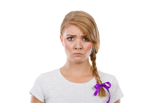 Teenage girl in braid hair making angry face