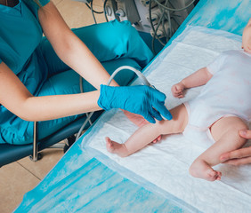 Doctor and little boy patient. Ultrasound equipment. Diagnostics. Sonography.