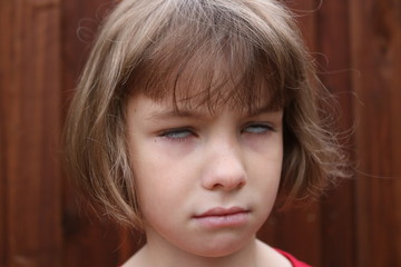 Portrait of a young girl rolling her eyes
