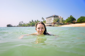 Woman bathing in the ocean 