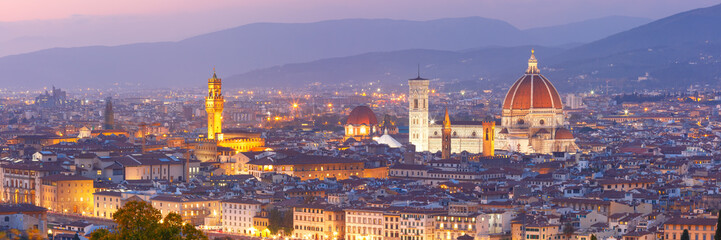 Fototapeta na wymiar Beautiful panoramic view of Duomo Santa Maria Del Fiore and tower of Palazzo Vecchio during evening blue hour in Florence, Tuscany, Italy