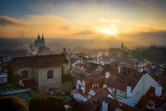 Misty Saint Nicolas church and Lesser town area. Prague, Czech republic