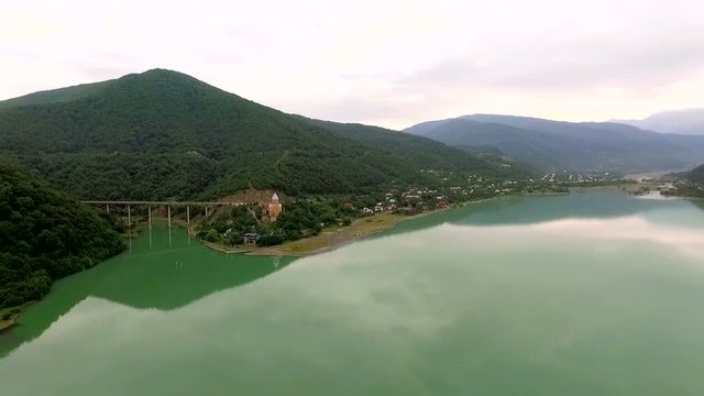 Gergeti, GEORGIA Aerial view of Gergeti Trinity Church, Tsminda Sameba near Gergeti, Georgia. Camera flies on drone above mountains and church
