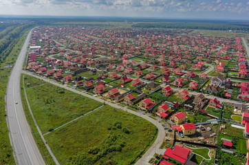 Tyumen, Russia - July 29, 2016: Aerial view onto Komarovo housing estates and Tyumen-Kurgan federal...