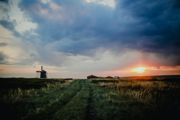 Windmill standing in a field 