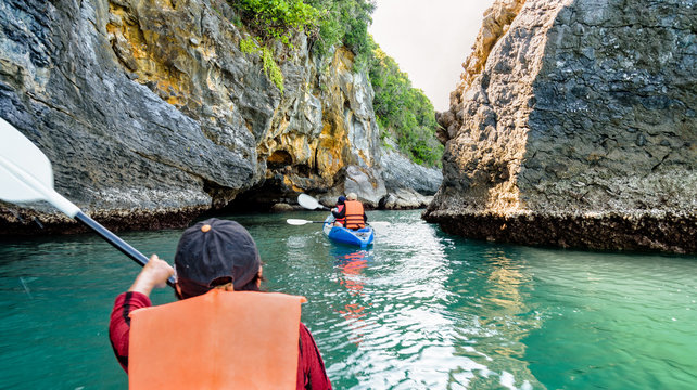 Group of tourists on a kayak.Travel by boat around Ko Phi enjoy the nature of the sea and islands in the summer at Mu Ko Ang Thong National Marine Park, Surat Thani province, Thailand ,16:9 widescreen