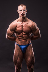 young bodybuider posing