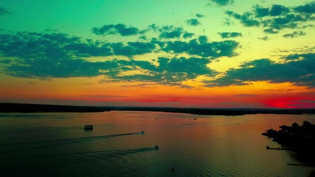 Aerial shot rising high above Lake Paranoa at sunset