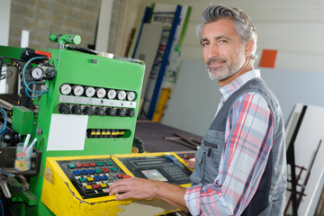 worker tending a machine