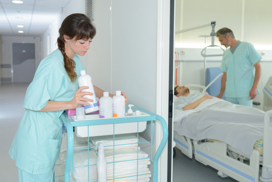 Nurse With A Trolley Of Medicine