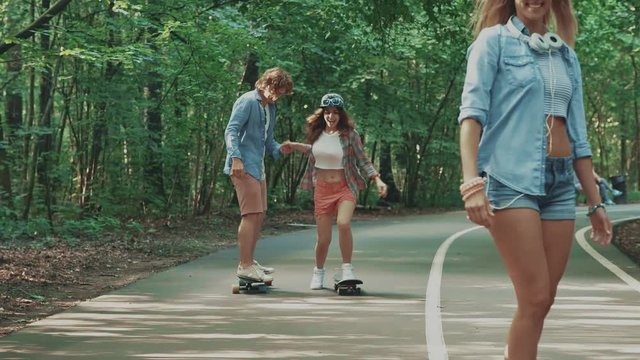 Young teenagers skateboarding outdoors