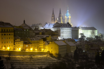 Fototapeta na wymiar Saint Vitus Cathedral. Snowy atmosphere during winter night. Unesco, Prague, Czech republic