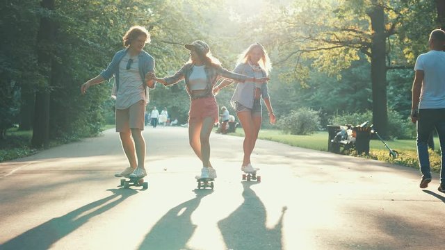 Teenagers skateboarding in the summer