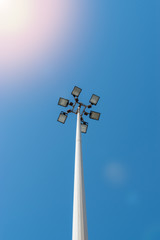 Lamppost on street with blue sky