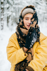 Lovely girl with angelic beautiful face. Odd bizarre person. Kinky female in winter snowy forest...