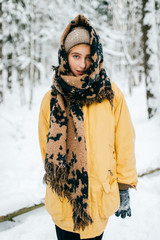 Lovely girl with angelic beautiful face. Odd bizarre person. Kinky female in winter snowy forest...