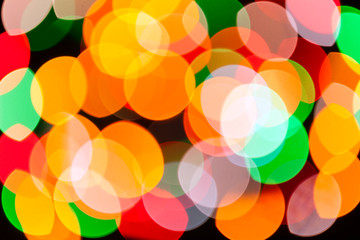 Bright blurred festive and colorful Christmas lights abstract background texture. Concept for party, xmas, new year eve, rave, psychedelic, strobes