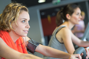 Fototapeta premium positive smiling working out in modern fitness club