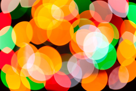 Bright Blurred Festive And Colorful Christmas Lights Abstract Background Texture. Concept For Party, Xmas, New Year Eve, Rave, Psychedelic, Strobes