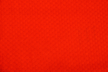 
Texture of a bright red synthetic fabric, like a background.