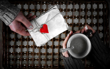 Naklejka na ściany i meble man gift for girl drinks coffee gift on Valentine's Day