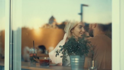 Kissing couple in cafe