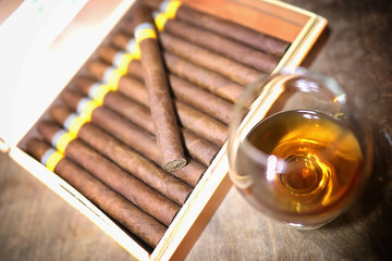 Large box of Cuban cigars on a wooden table