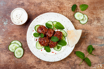 Middle eastern spiced lamb meatballs with cucumber, mint and yogurt sauce. Oriental, arab cuisine © sveta_zarzamora