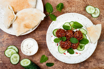 Middle eastern spiced lamb meatballs with cucumber, mint and yogurt sauce. Oriental, arab cuisine © sveta_zarzamora