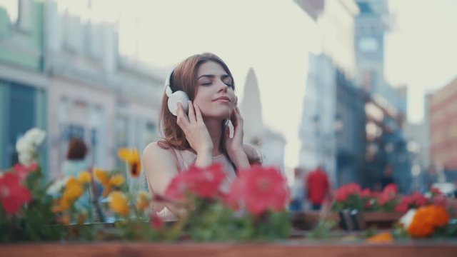 Beautiful girl listens to music