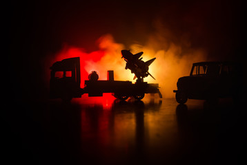Rocket launch with fire clouds. Battle scene with rocket Missiles with Warhead Aimed at Gloomy Sky at night. Rocket vehicle on War Backgound.