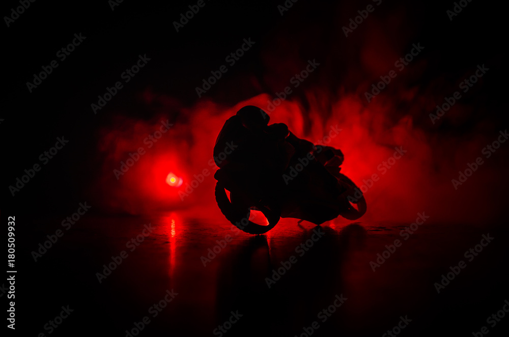 Wall mural High power motorcycle chopper. Fog with backlights on background with man rider at night