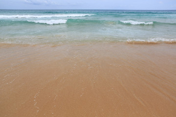 Background of sea wave and sand beach.