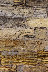 An old destroyed wall with large large cracks. Background of crack on an old wall as background for creative design. Destroyed cracked wall of building after earthquake and hurricane