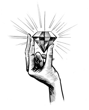Hand holding a big shiny diamond