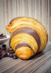 Chocolate croissant with coffee