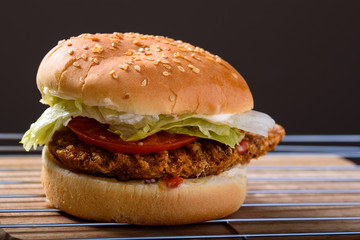 Crispy chicken burger sandwich with condiments