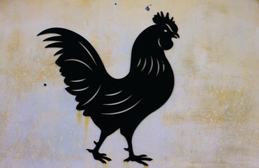 Black rooster shape texture on the wall (Fano, Italy)